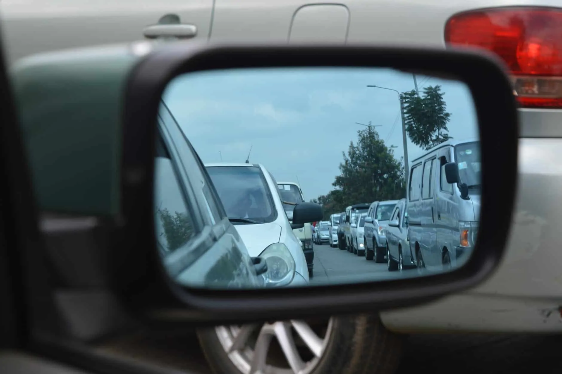 Photo of a traffic jam and side mirror