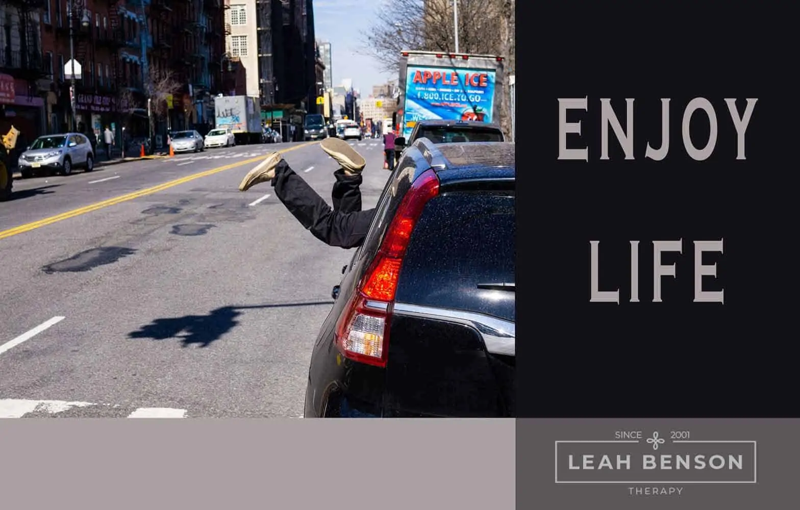 Photo of car and street scene with the words, "Enjoy Life"