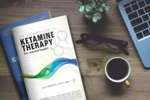Ketamine therapy book on table with a cup of coffee